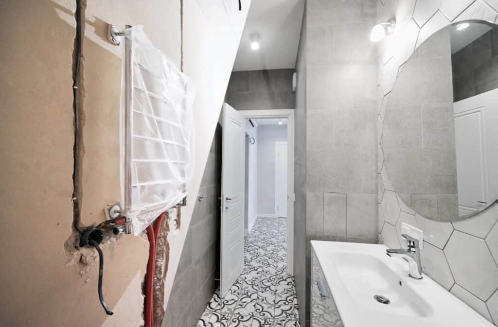 a bathroom with a sink and a wall